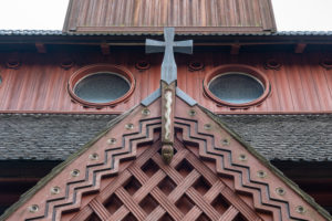 Germany, Lower Saxony, Harz, Goslar, entrance portal with cross of the Gustav Adolf stave church in Hahnenklee, built in 1907 - 1908, modeled on the stave church of Borgund in Norway. Germany, Lower Saxony, Harz, Goslar, entrance portal with cross of the Gustav Adolf stave church in Hahnenklee, built in 1907 - 1908, modeled on the stave church of Borgund in Norway.